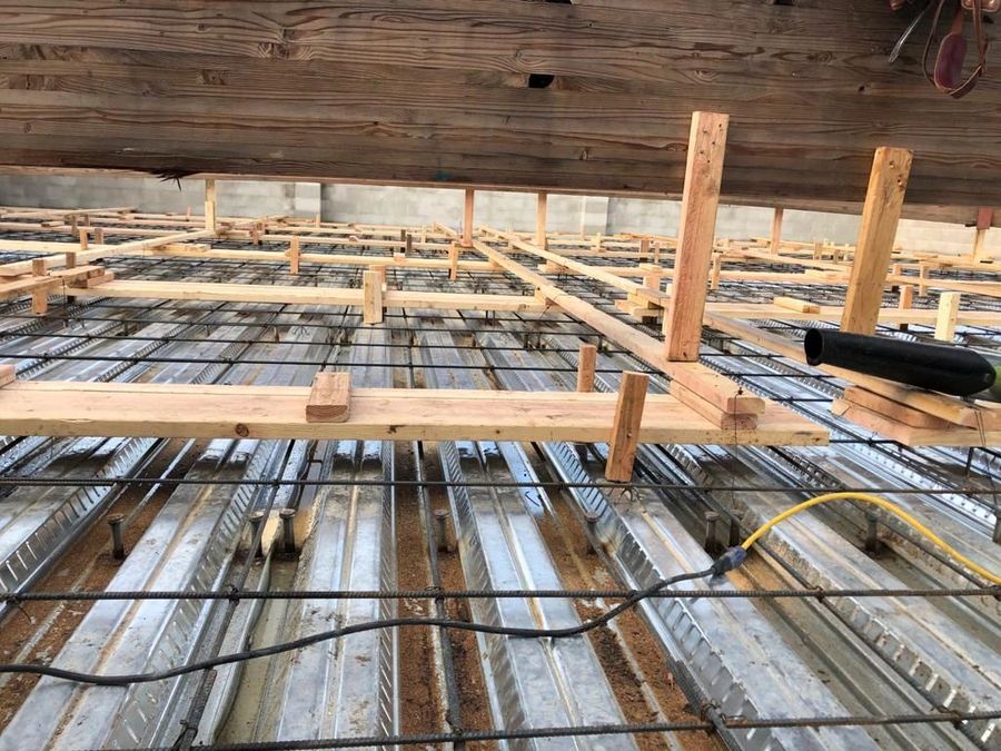 Steel deck with rebar and timber shoring ahead of a structural pour