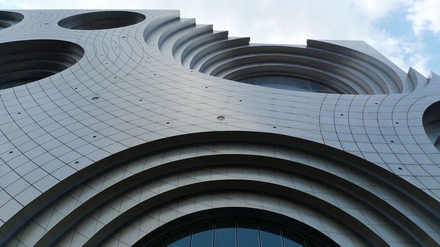 Finished curved concrete-panel building facade